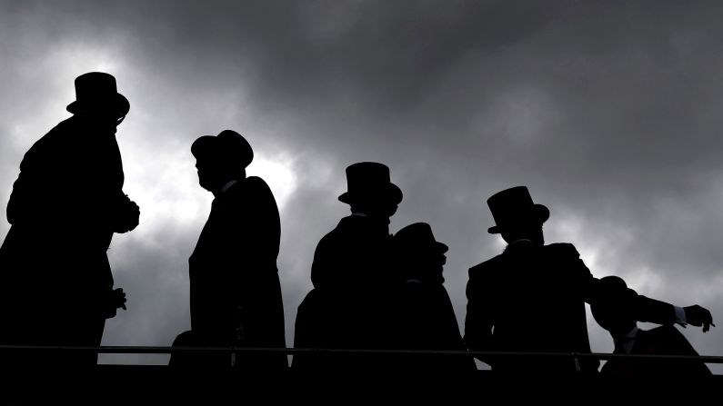 Racegoers are silhouetted as they attend the derby day of the 2018 Investec Derby Festival, at Epsom Downs Racecourse, in England, on Saturday, June 2. <a href="index.php?page=&url=https%3A%2F%2Fwww.cnn.com%2F2018%2F05%2F27%2Fsport%2Fgallery%2Fwhat-a-shot-sports-0528%2Findex.html" target="_blank">See 28 amazing sports photo from last week </a>