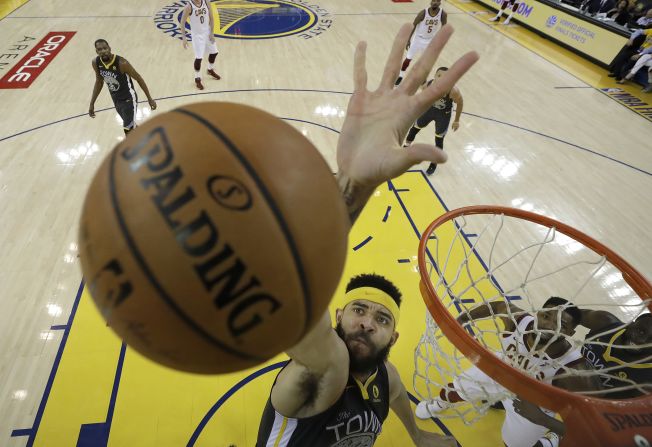 McGee snatches a rebound off the glass in the second half of Game 2.