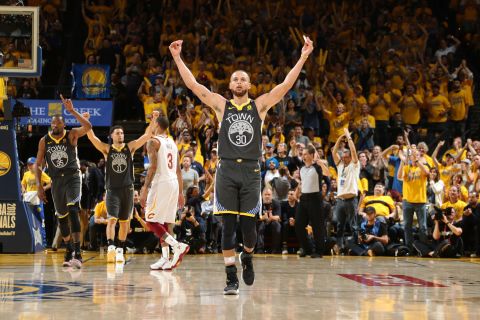Curry celebrates as his team wraps up a Game 2 victory on Sunday, June 3. Curry hit a Finals-record nine 3-pointers as the Warriors won 122-103.