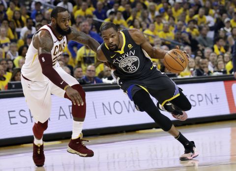 Durant drives past James in the first half of Game 2.