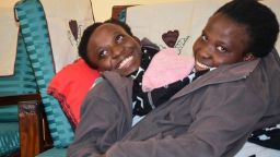 Maria (L) and Consolata Mwakikuti in the student hostel of Ruaha Catholic University on their first day.