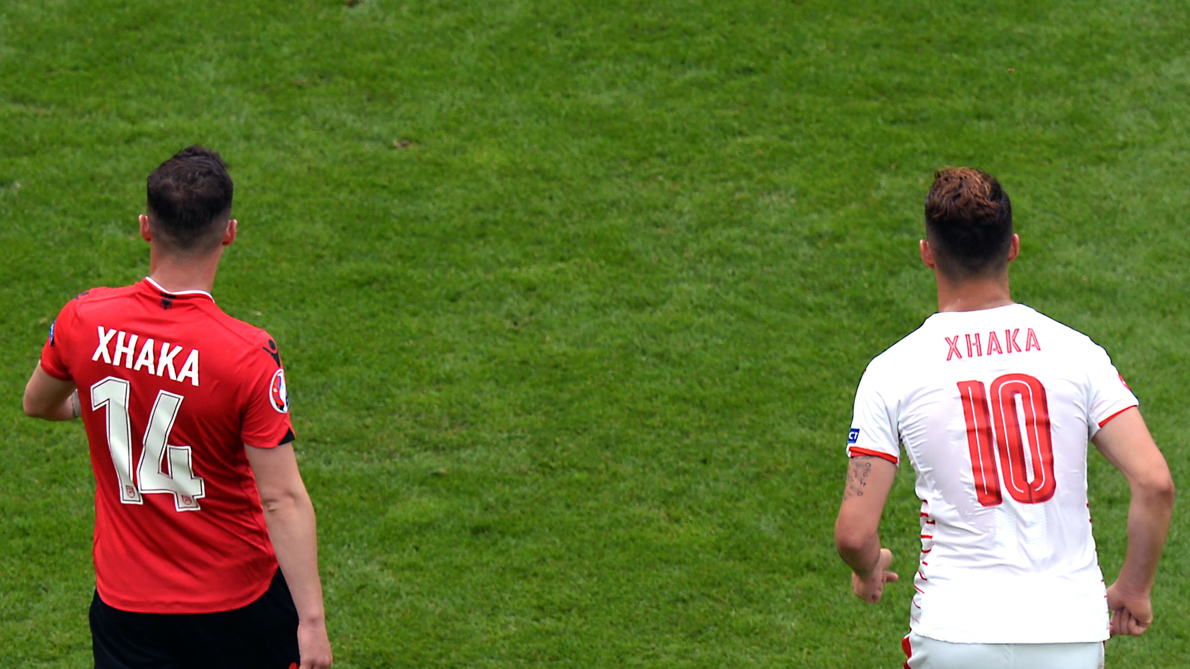 Albania's midfielder Taulant Xhaka (L) walks next to his brother Switzerland's midfielder Granit Xhaka during the Euro 2016 group A football match between Albania and Switzerland at the Bollaert-Delelis Stadium in Lens on June 11, 2016. / AFP / Denis CHARLET        (Photo credit should read DENIS CHARLET/AFP/Getty Images)