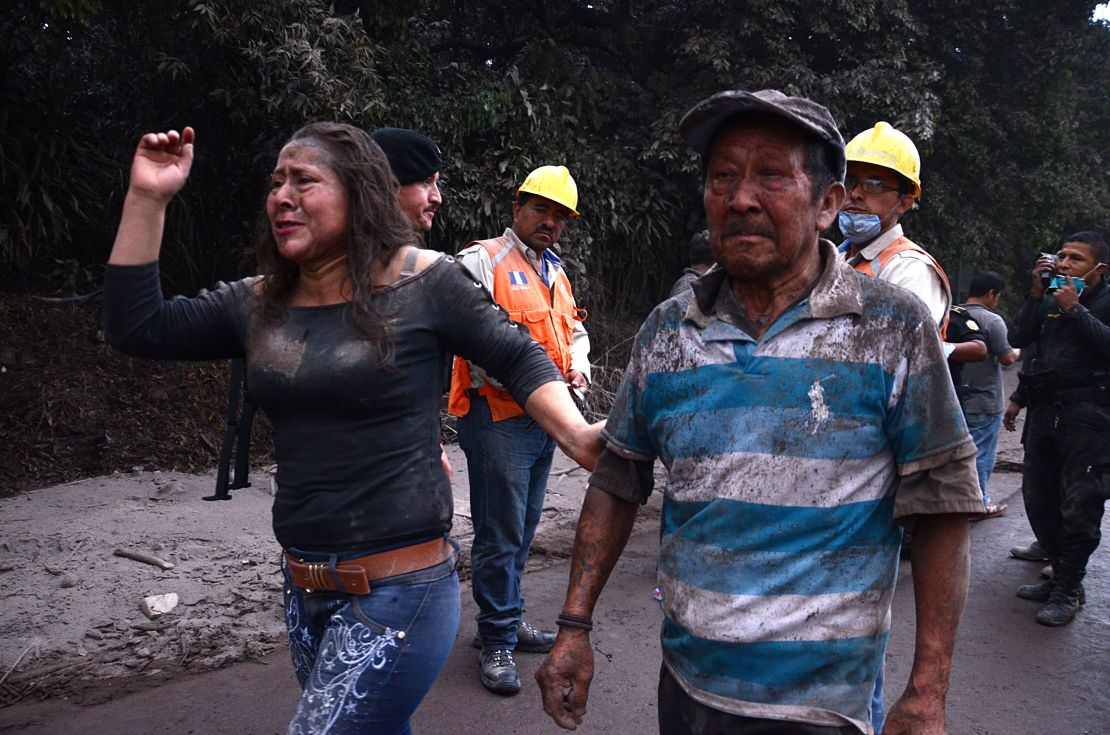 Residents flee El Rodeo village after the Fuego volcano's eruption Sunday.
