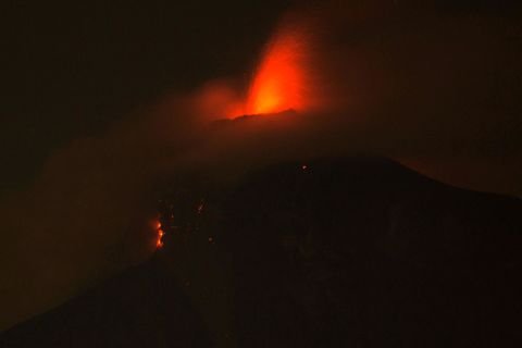 The volcano spews molten rock from its crater in Alotenango on Sunday, June 3.