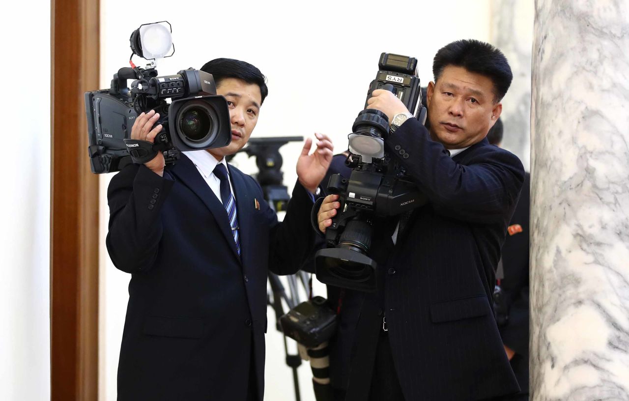 North Korean cameramen film at the Palace.