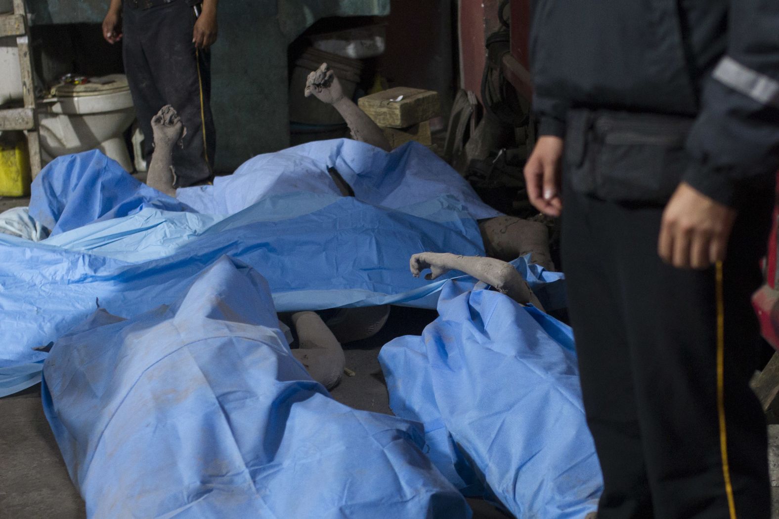 Bodies are laid in a temporary morgue in Alotenango.