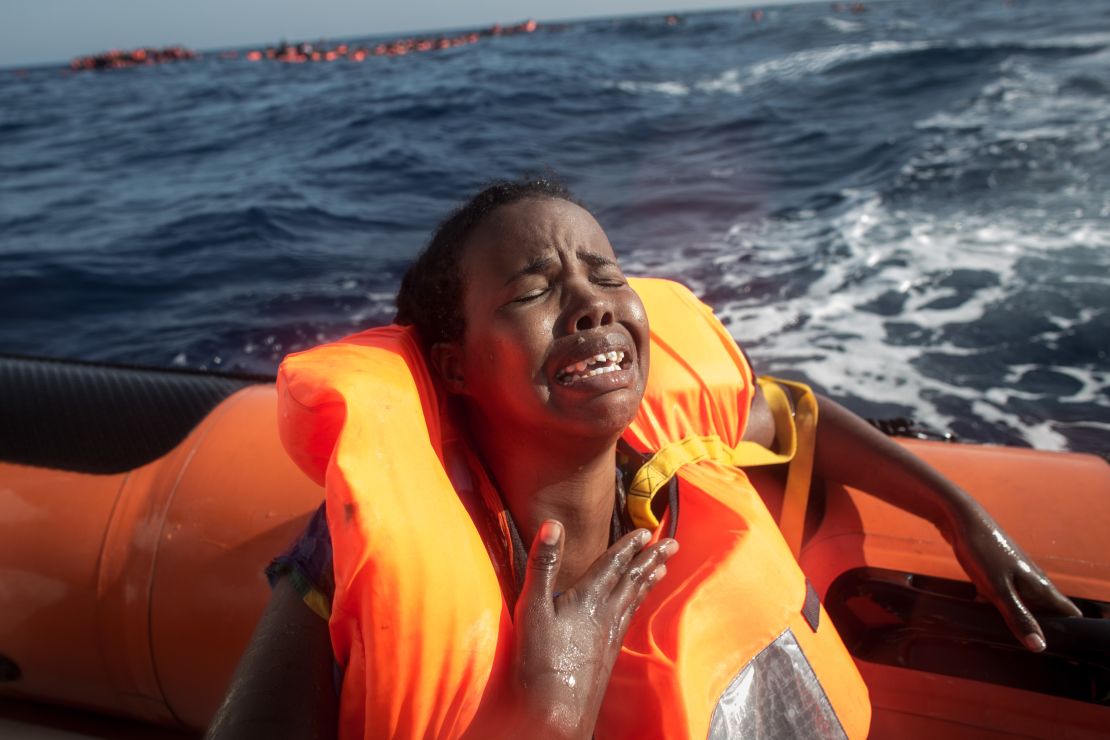 A refugee cries after losing her baby in the water off the Italian coast in May.