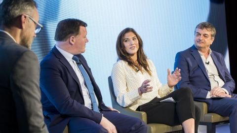 Damian Collins, Hope Solo, and Jerome Champagne take part in a panel discussion as The Foundation for Sports Integrity (FFSI) holds its inaugural Sports, Politics and Integrity conference.  