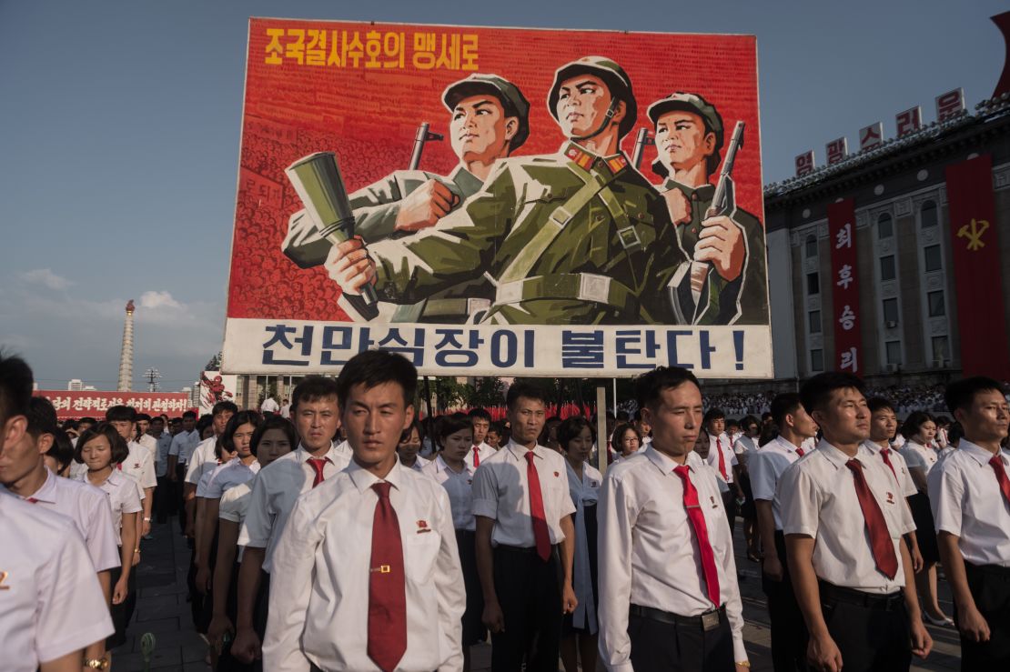 A propaganda poster is displayed during a rally in support of North Korea's stance against the United States, on Kim Il Sung square in Pyongyang on August 9, 2017. 