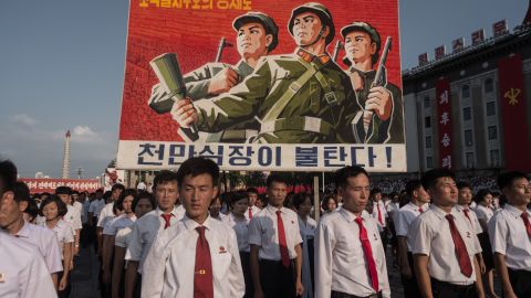 A propaganda poster is displayed during a rally in support of North Korea's stance against the United States, on Kim Il Sung square in Pyongyang on August 9, 2017. 