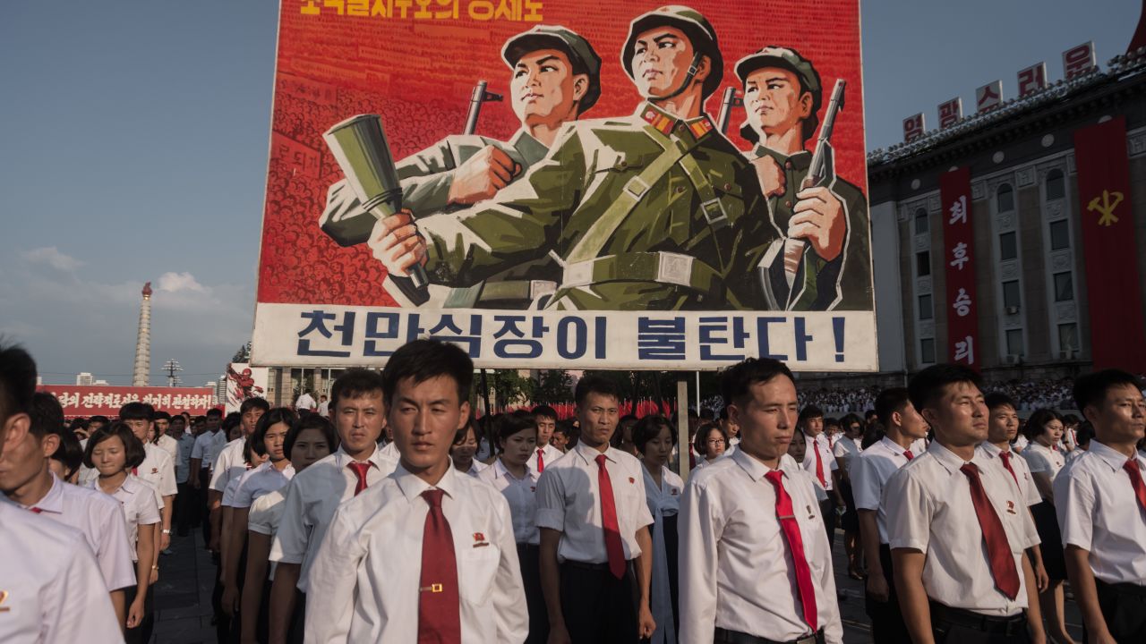 A propaganda poster is displayed during a rally in support of North Korea's stance against the United States, on Kim Il Sung square in Pyongyang on August 9, 2017.