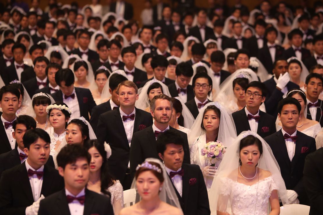 Some 4,000 'Moonies,' believers of Unification Church which was named after the founder Moon Sun Myung, attend the mass wedding which began in the early 1960s. 