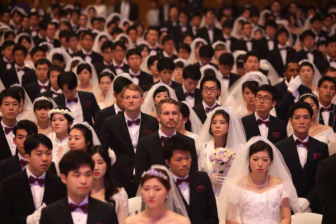 Some 4,000 'Moonies,' believers of Unification Church which was named after the founder Moon Sun Myung, attend the mass wedding which began in the early 1960s.