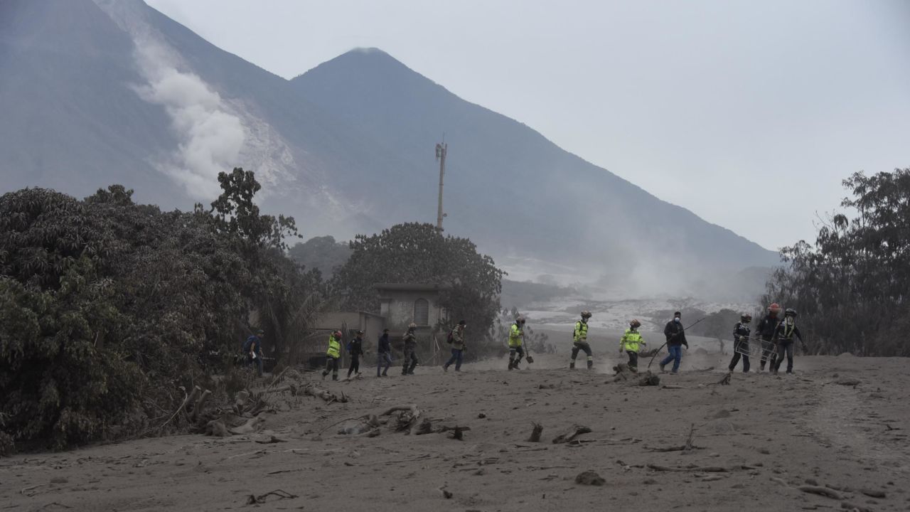 Rescuers search for victims in San Miguel Los Lotes, a village in Escuintla Department, about 35 kilometers southwest of Guatemala City.
