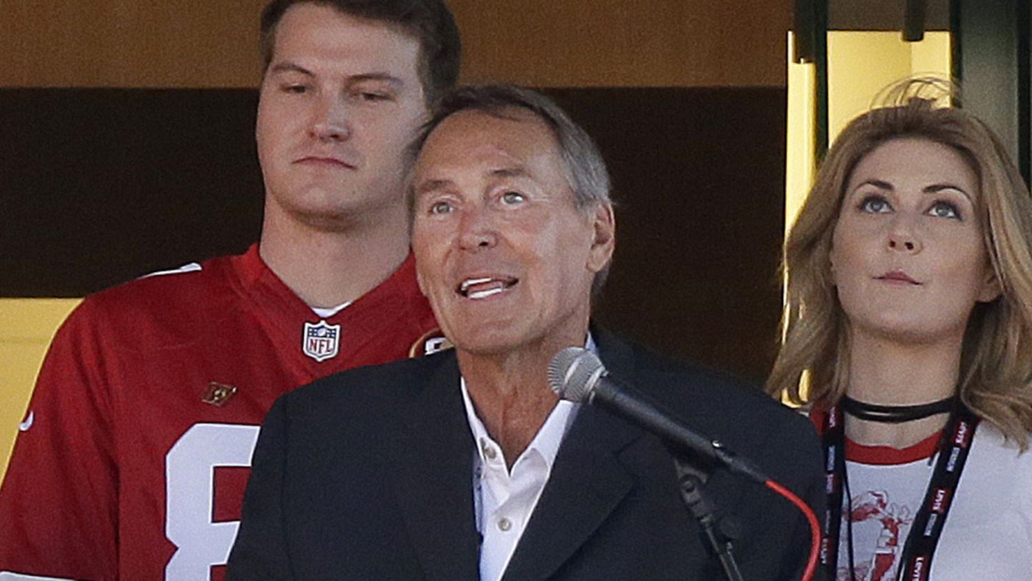 Dwight Clark, center, speaks during halftime at a  game between the 49ers and the Dallas Cowboys in October 2017. 