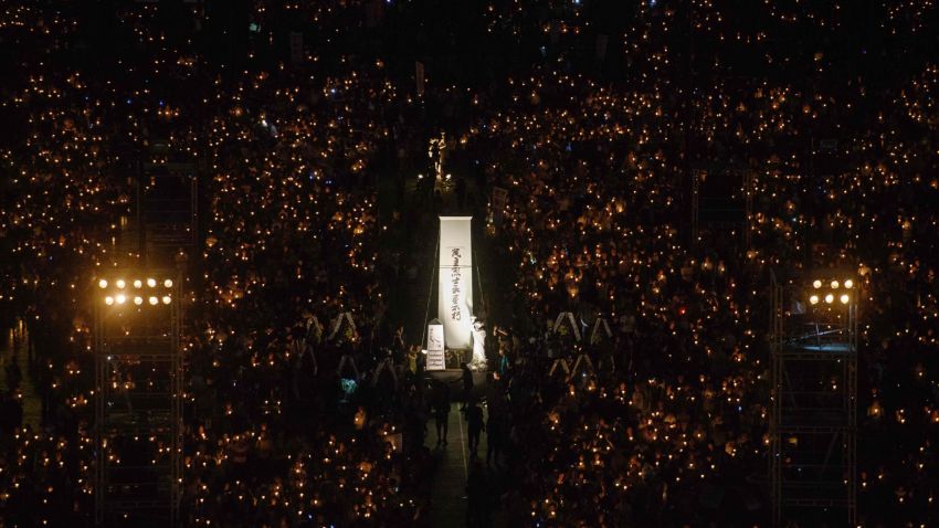 People hold candles during a vigil in Hong Kong on June 4, 2018, to mark the 29th anniversary of the 1989 Tiananmen crackdown in Beijing.