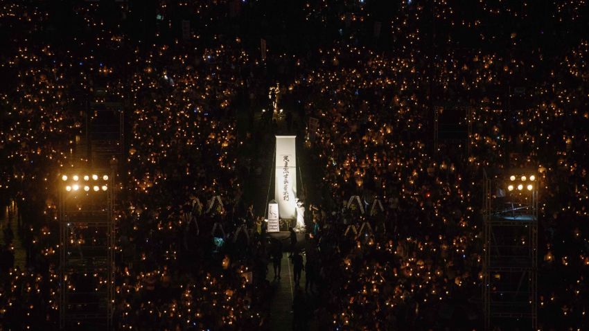 People hold candles during a vigil in Hong Kong on June 4, 2018, to mark the 29th anniversary of the 1989 Tiananmen crackdown in Beijing. 