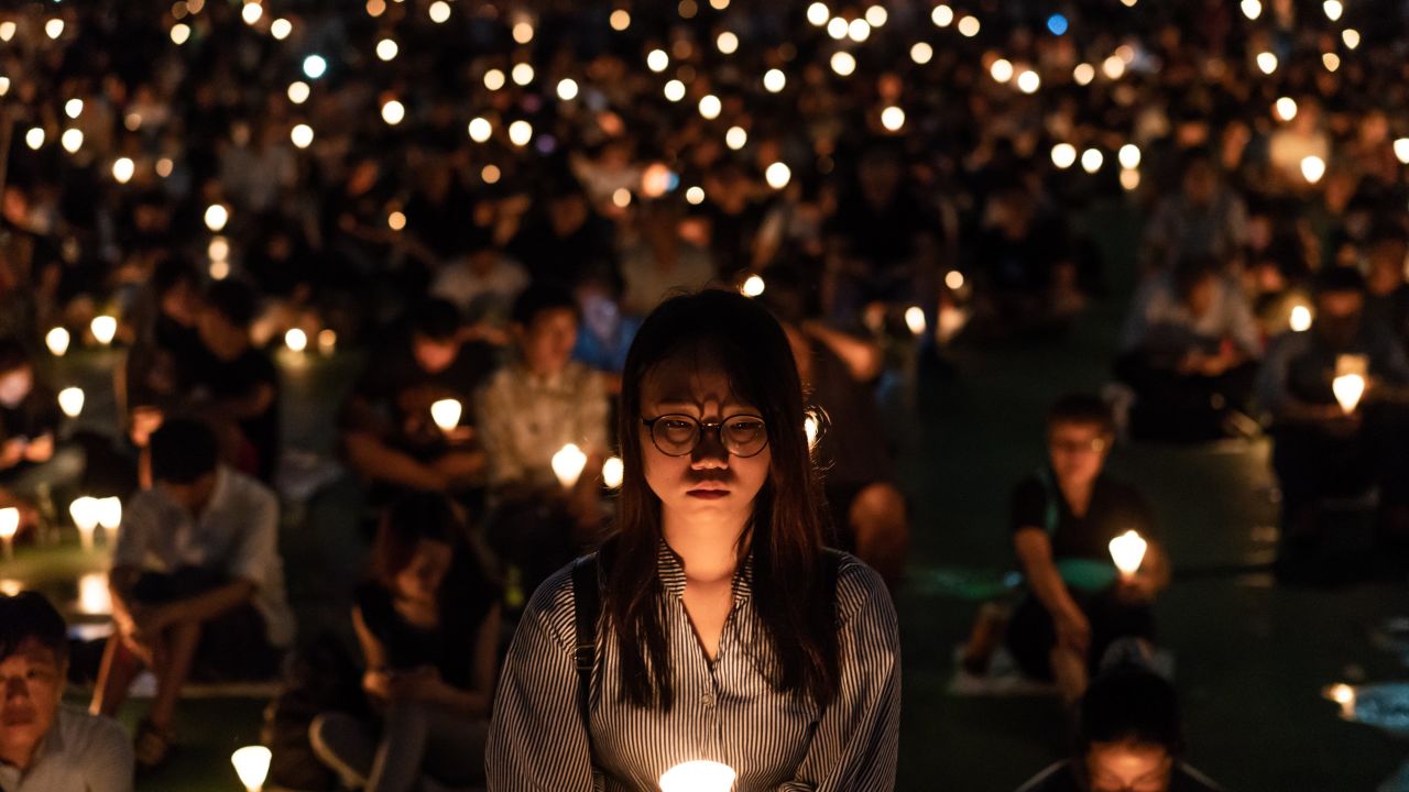 Participants take part at the candlelight vigil at Victoria Park on June 4, 2018 in Hong Kong.