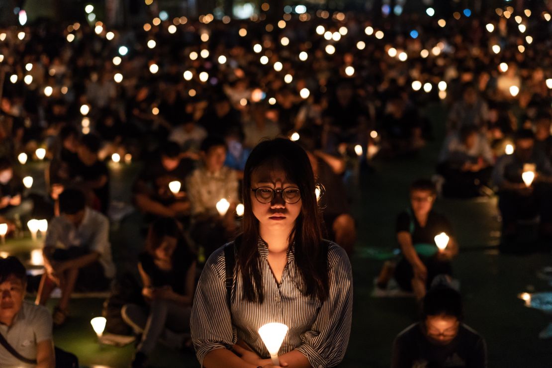 Participants take part at the candlelight vigil at Victoria Park on June 4, 2018 in Hong Kong.
