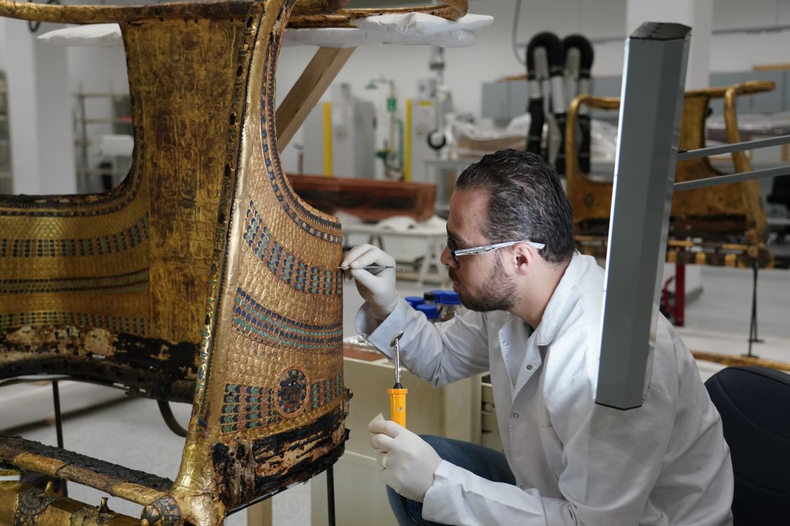 Rami Magdy works on the restoration of a chariot from Tutankhamun's tomb at the Wood Laboratory in the Grand Egyptian Museum's conservation center. The first phase of the GEM will open the end of this year and will feature a special display of thousands of treasures from Tutankhamun's tomb, many never  before on dislplay.