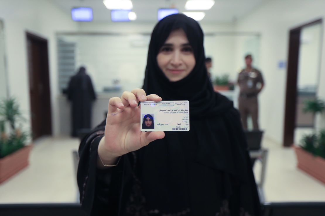 Tahani Aldosemani, Assistant Professor and Undersecretary of the Deanship of the Technology Department at Prince Sattam Bin Abdulaziz University in Al-Kharj, holds her new driving licence in a photo issued by the Kingdom of Saudi Arabia.