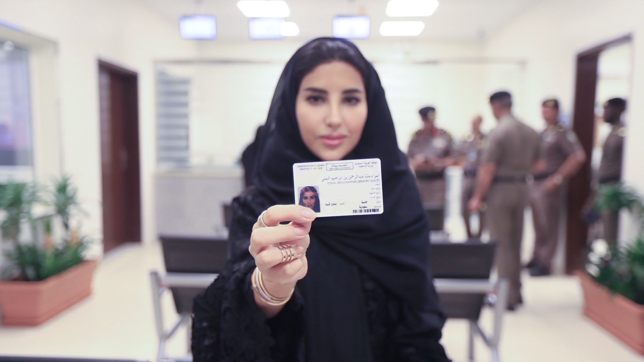 Esraa Albuti, an Executive Director at Ernst & Young, holds her new driving licence  issued by the Kingdom of Saudi Arabia. 