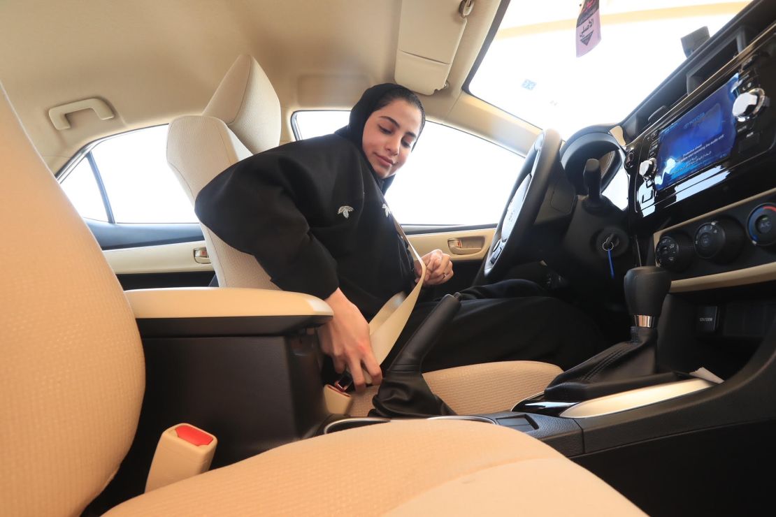 A Saudi woman buckles up in a test car before doing a driving test at the General Department of Traffic in the Saudi capital of Riyadh.