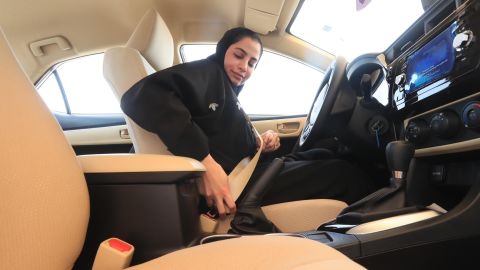 A Saudi woman buckles up in a test car before doing a driving test at the General Department of Traffic in the Saudi capital of Riyadh.