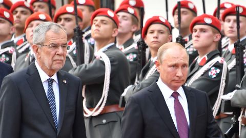 Austria's President Alexander van der Bellen (left) and Russian President Vladimir Putin inspect a military honor guard at the Presidential palace in Vienna, Austria, on Tuesday.