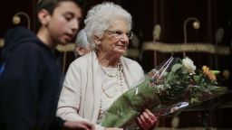 Holocaust survivor Sen. Liliana Segre receives flowers after a speech earlier this year.