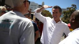 OAKLAND, CA - JUNE 02:  California Lt. Gov. and democratic candidate for California governor Gavin Newsom (C) greets supporters during a campaign stop at California Assemblyman Rob Bonta's Chili Cook Off on June 2, 2018 in Oakland, California.  With less than a week to go until the California primary, Gavin Newsom is campaigning throughout the state.  (Photo by Justin Sullivan/Getty Images)