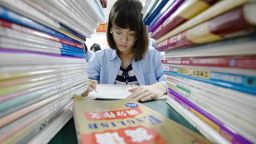 This photo taken on May 23, 2018 shows a high school student going through exam papers, ahead of the annual "Gaokao" or college entrance examinations in China, in Handan in China's northern Hebei province. - China's Gaokao will take place on June 7 and June 8 this year. (Photo by - / AFP) / China OUT        (Photo credit should read -/AFP/Getty Images)