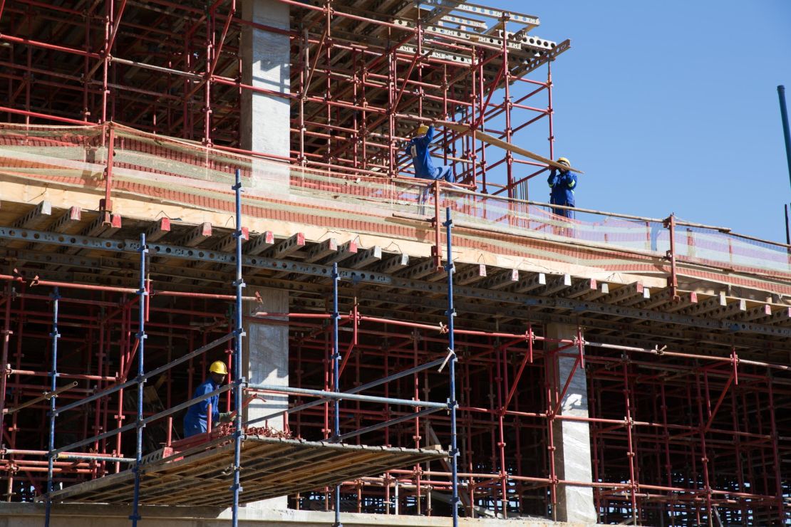 Workers construct the new government hospital in the capital Mbabane funded in part and built by Taiwan.