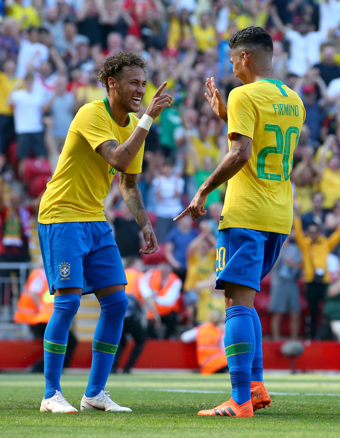 Brazil teammates Neymar and Roberto Firmino celebrate during a friendly against Croatia this month. If forecasts are right, the two attackers will be celebrating in Moscow at the World Cup final on July 15.