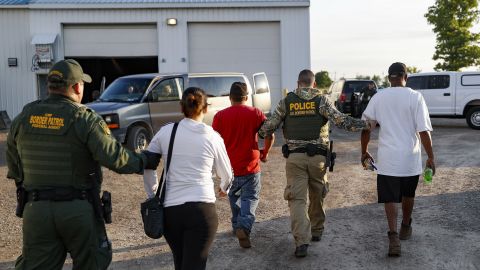 Government agents take suspects into custody during Tuesday's sting in Castalia, Ohio.