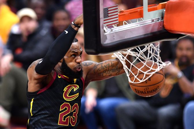 James throws down a dunk in the first half of Game 3. He finished with a triple-double: 33 points, 12 assists and 11 rebounds.