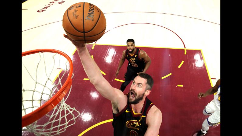 Cleveland's Kevin Love lays the ball in during the first half of Game 3. Love had 15 points and 10 rebounds by halftime as the Cavaliers had a 6-point lead.