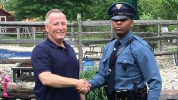 New Jersey State Trooper Michael Patterson, right, pulled over retired police officer Matthew Bailly and realized that Bailly had delivered him as a baby.