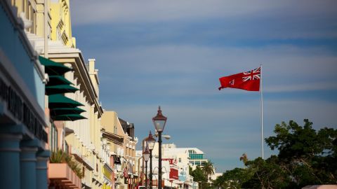 The flag of Bermuda flies over the commercial and retail district in Hamilton, Bermuda, in November  2017.