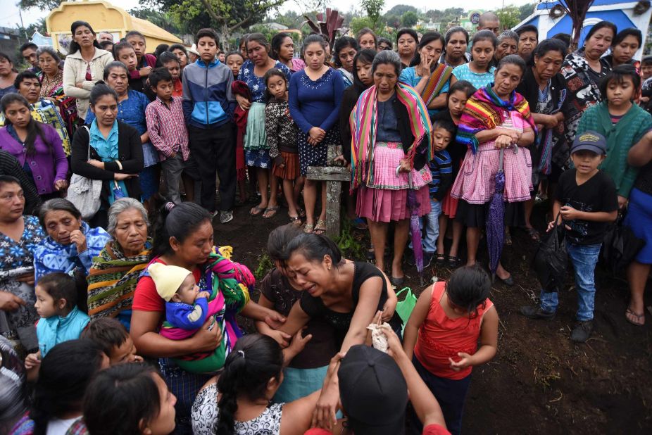 Relatives of 20-year-old victim Erick Rivas mourn his death during his funeral in Alotenango on June 6.