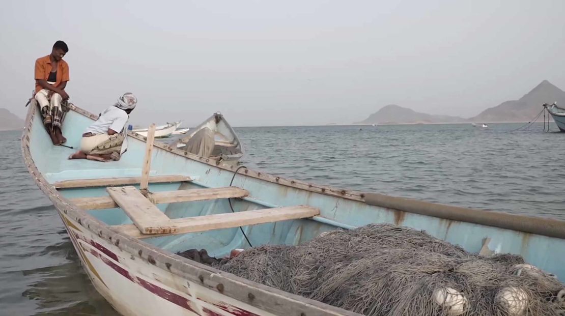 Fishermen at a village where human traffickers operate.
