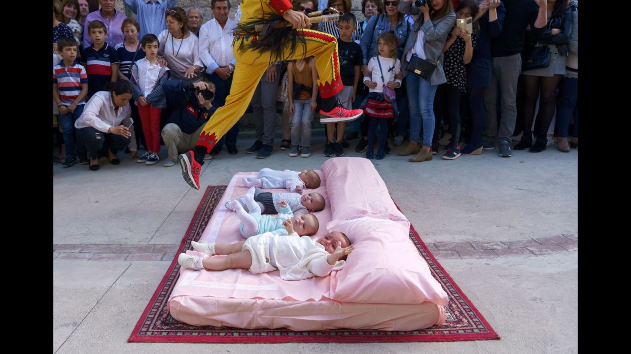 A man representing the devil jumps over babies Sunday, June 3, during a festival in the Spanish village of Castrillo de Murcia. The baby jumping festival has been taking place since 1620. The custom is believed to provide the babies protection, <a href="https://www.nationalgeographic.com/travel/destinations/europe/spain/el-colacho-baby-jumping-festival-murcia-spain/" target="_blank" target="_blank">according to National Geographic.</a>