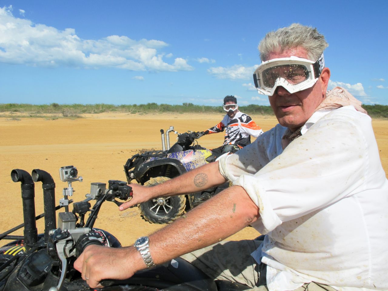 Bourdain rides an all-terrain vehicle in Colombia while filming "Parts Unknown." The CNN show premiered in 2013.
