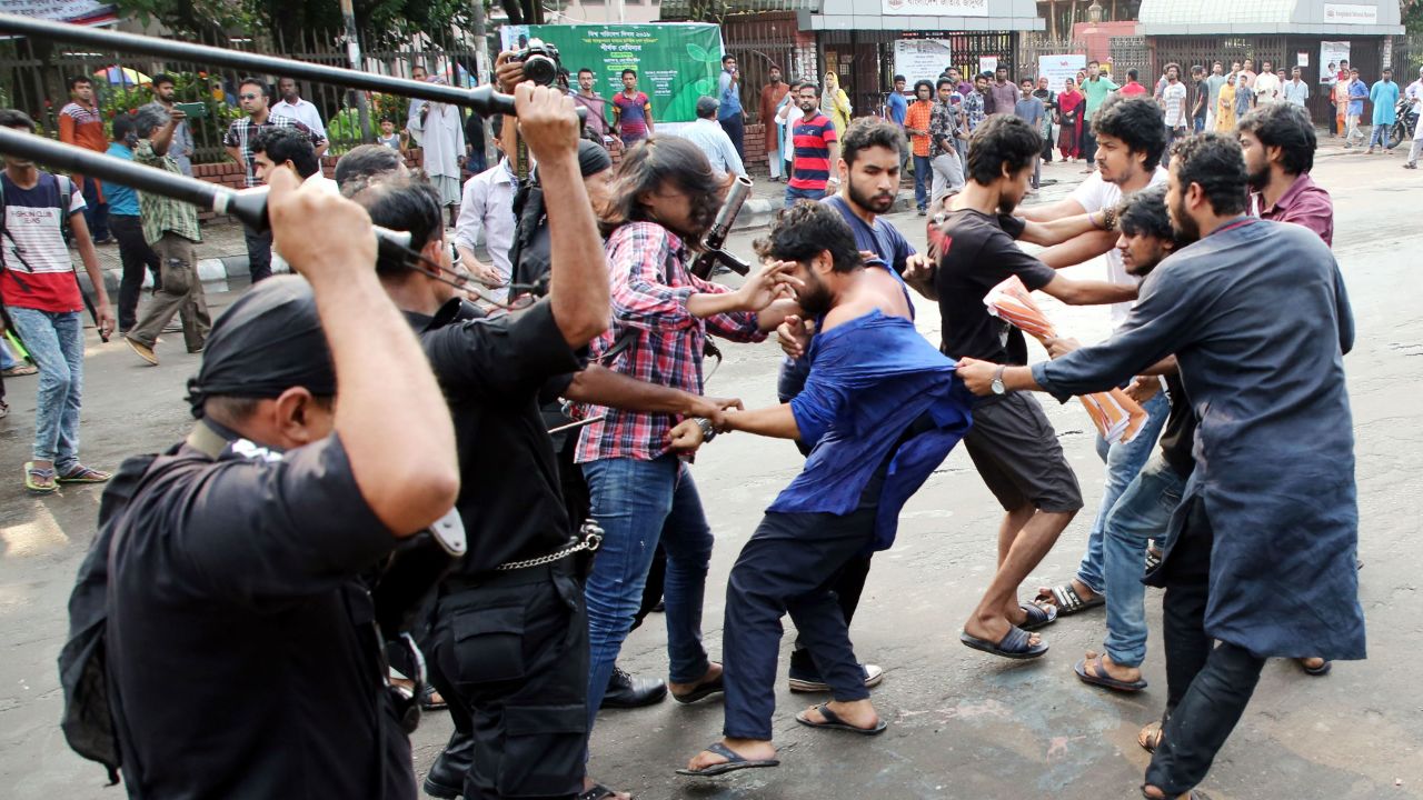 This photograph taken on June 6 shows members of the Rapid Action Battalion (RAB) baton-charging secular activists for protesting against alleged extrajudicial killings during the country's ongoing anti-drug drive, in Dhaka.