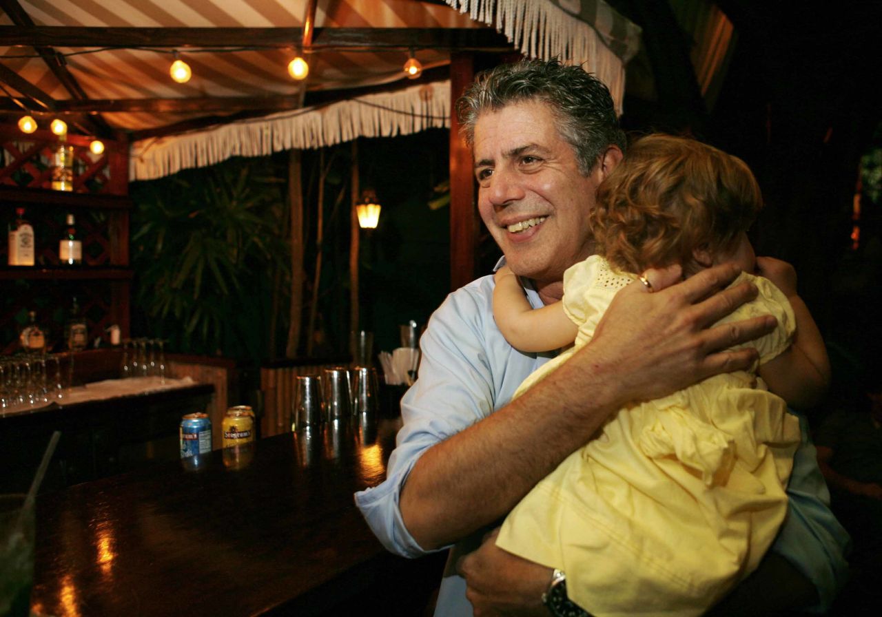 Bourdain holds his daughter, Ariane, in 2008. Ariane was his only child.