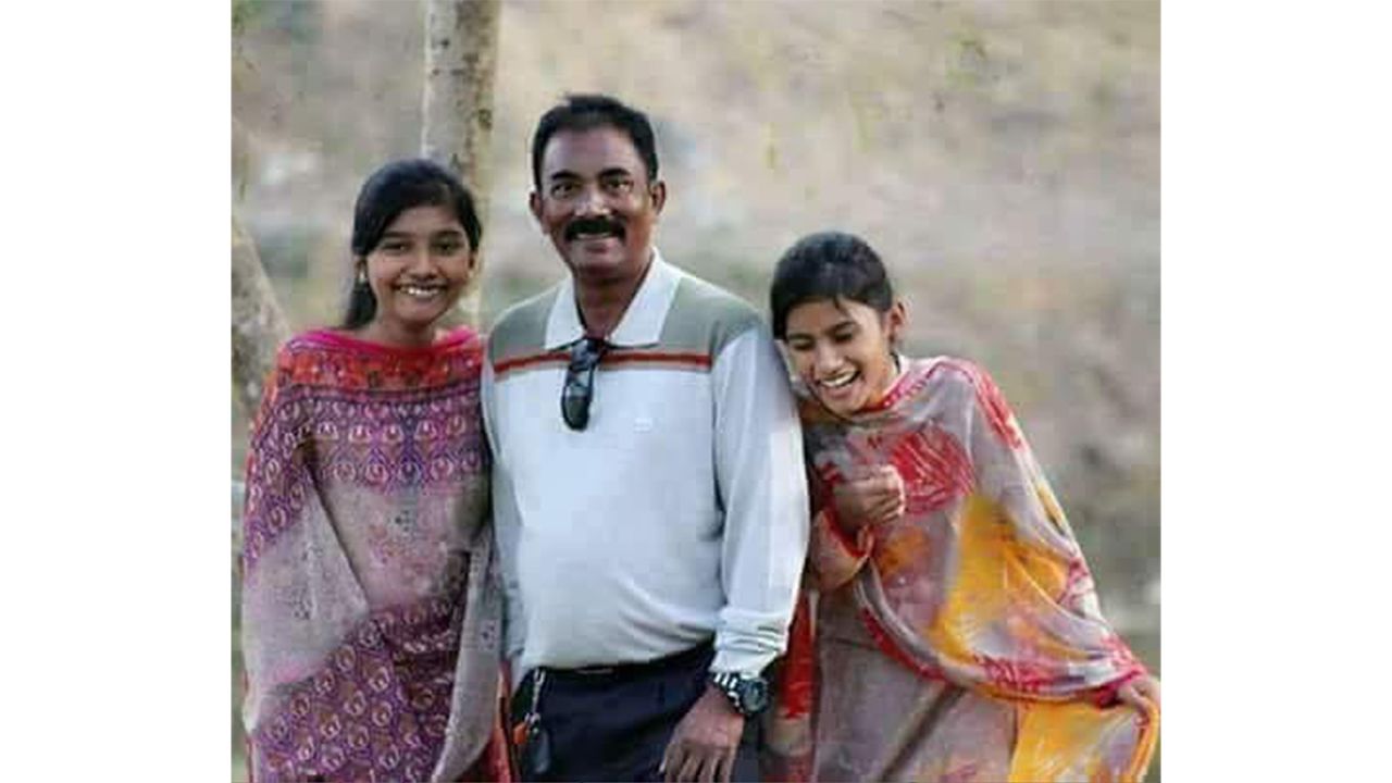 Akramul Haque and his two daughters