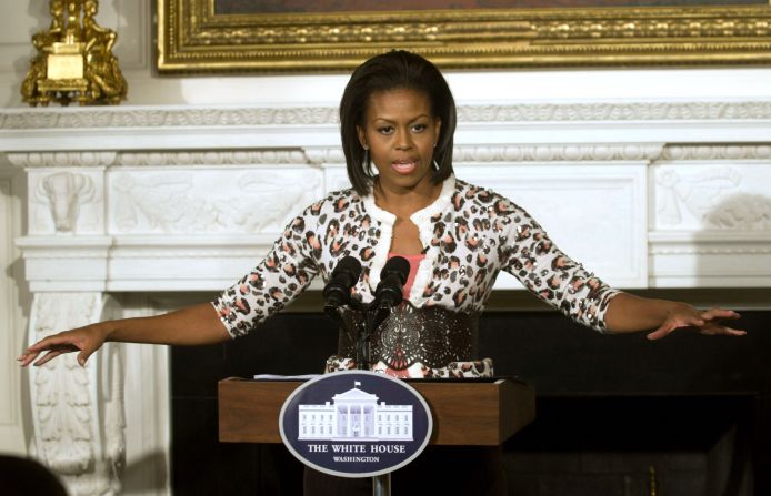 Michelle Obama wears a leopard cardigan at a public appearance in 2009. 