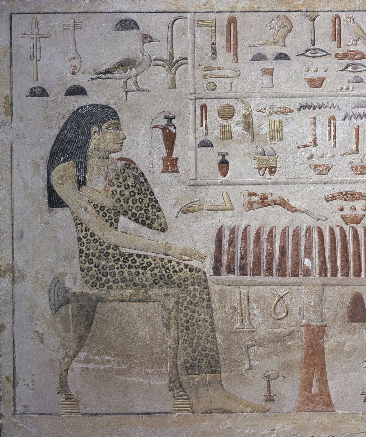 An Egyptian stele shows Nefertiabet, an ancient Egyptian princess wearing a leopard gown.