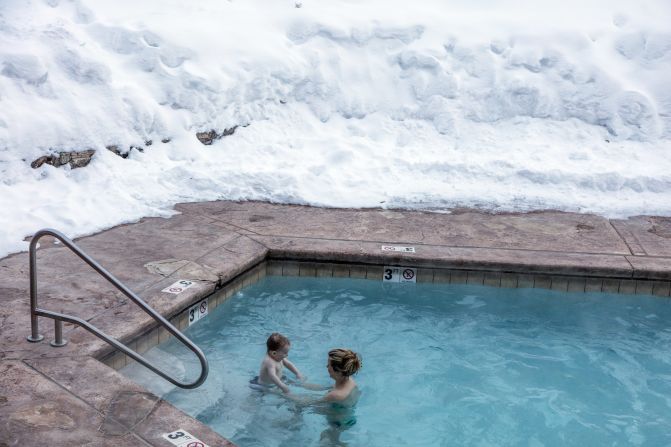 A mother and son in a hotel pool in Vail, Colorado.