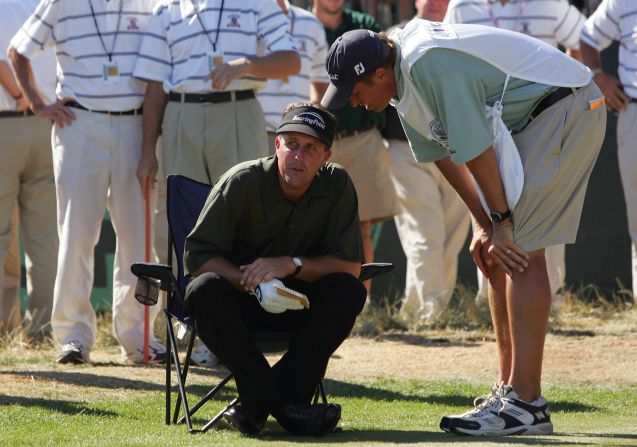 Play was held up while greens staff watered the course.